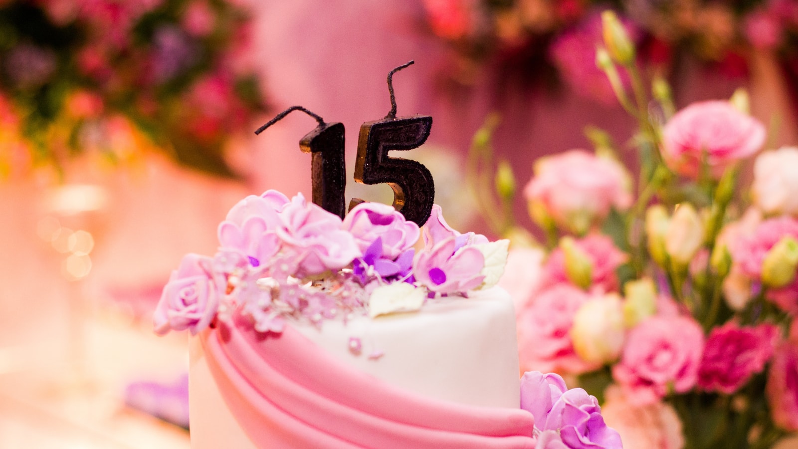 Birthday party backdrop with balloons and celebration decor
