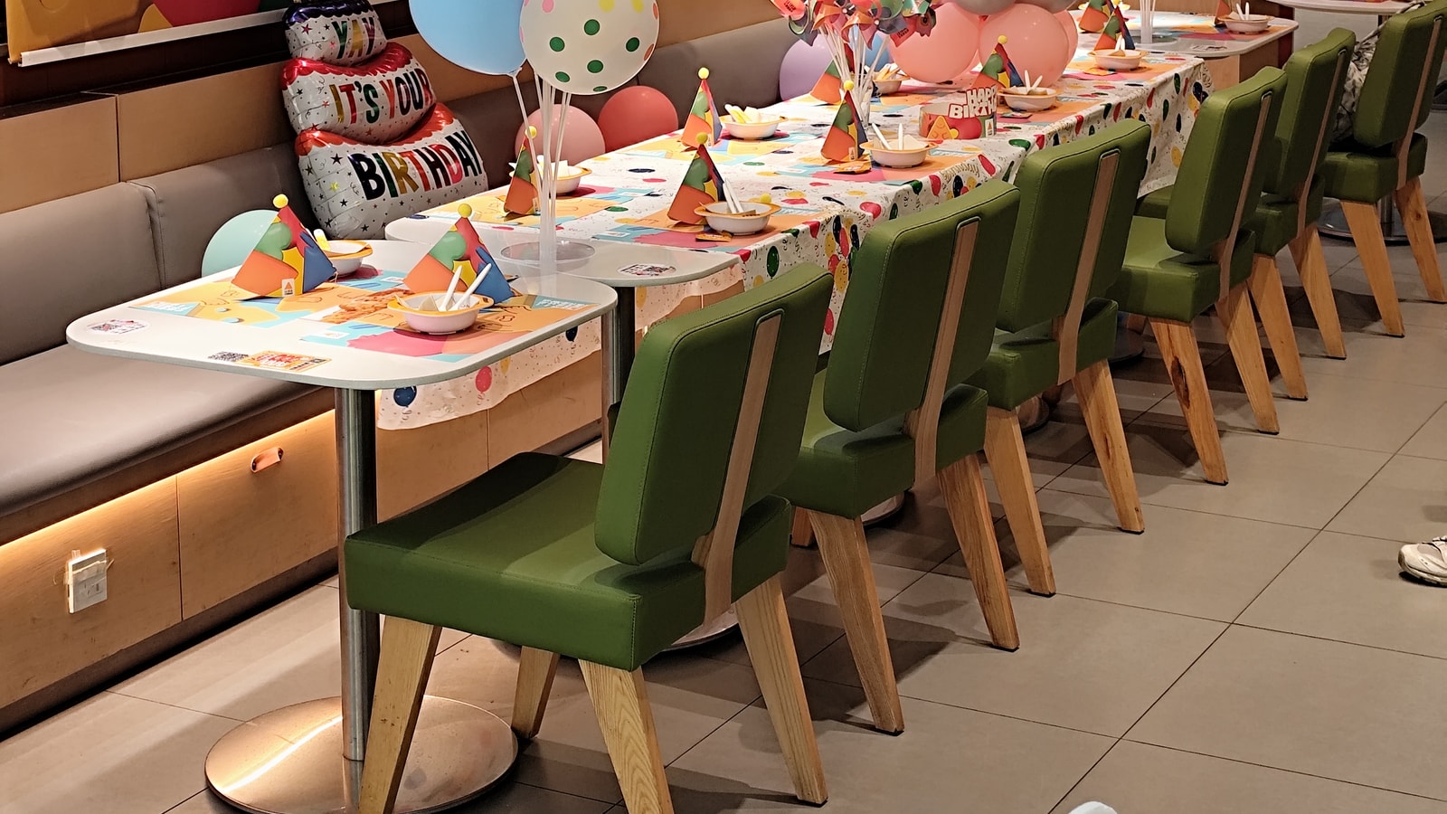 Birthday party backdrop with balloons and celebration decor