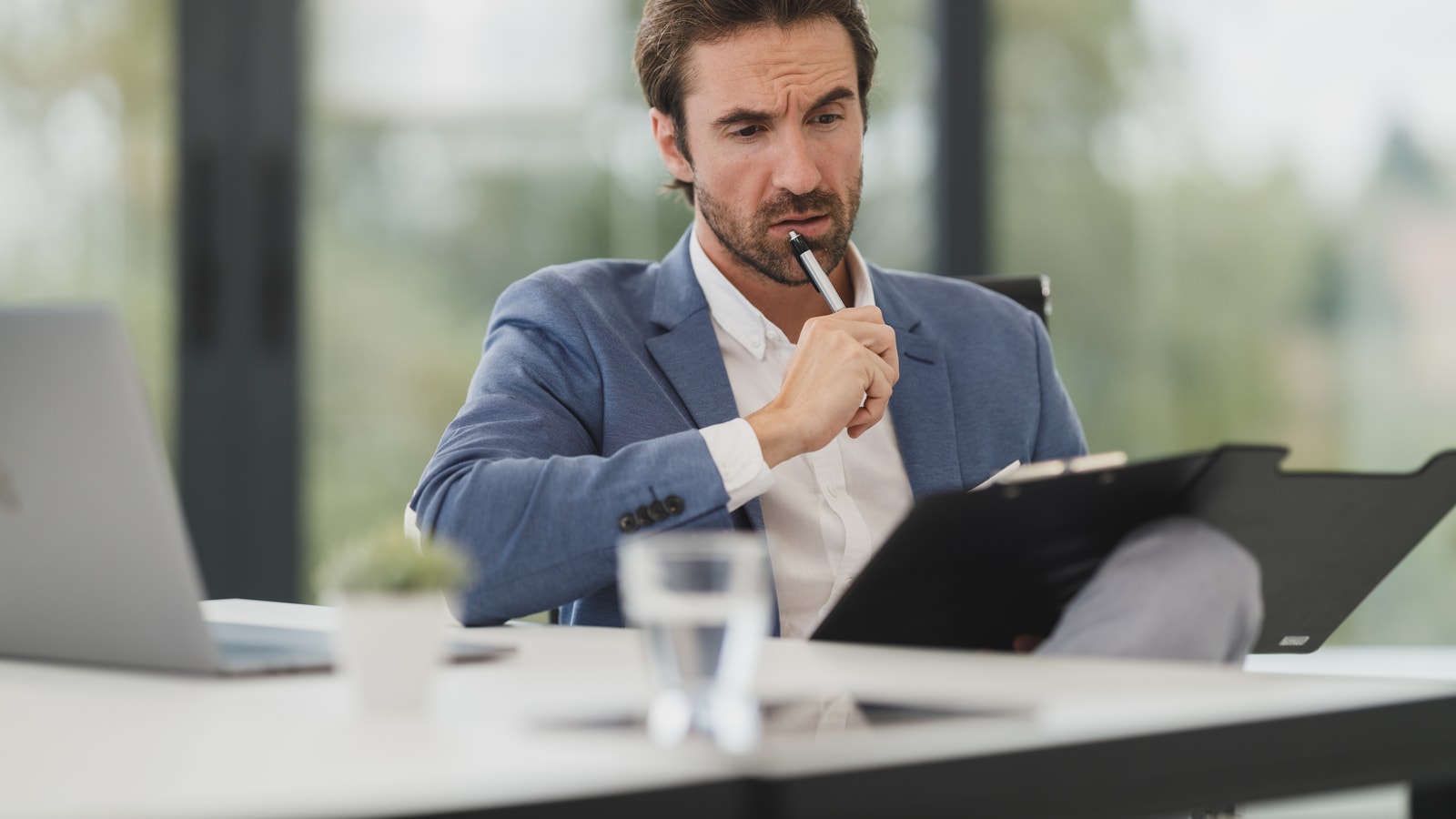 Business audit and compliance documents prepared for a review meeting