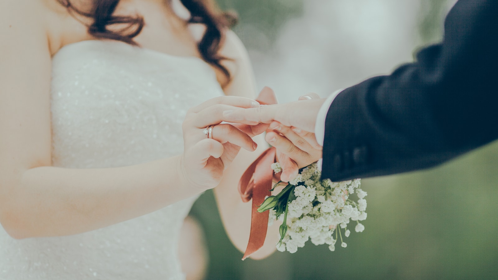 Wedding stage decor with flowers and warm event lighting