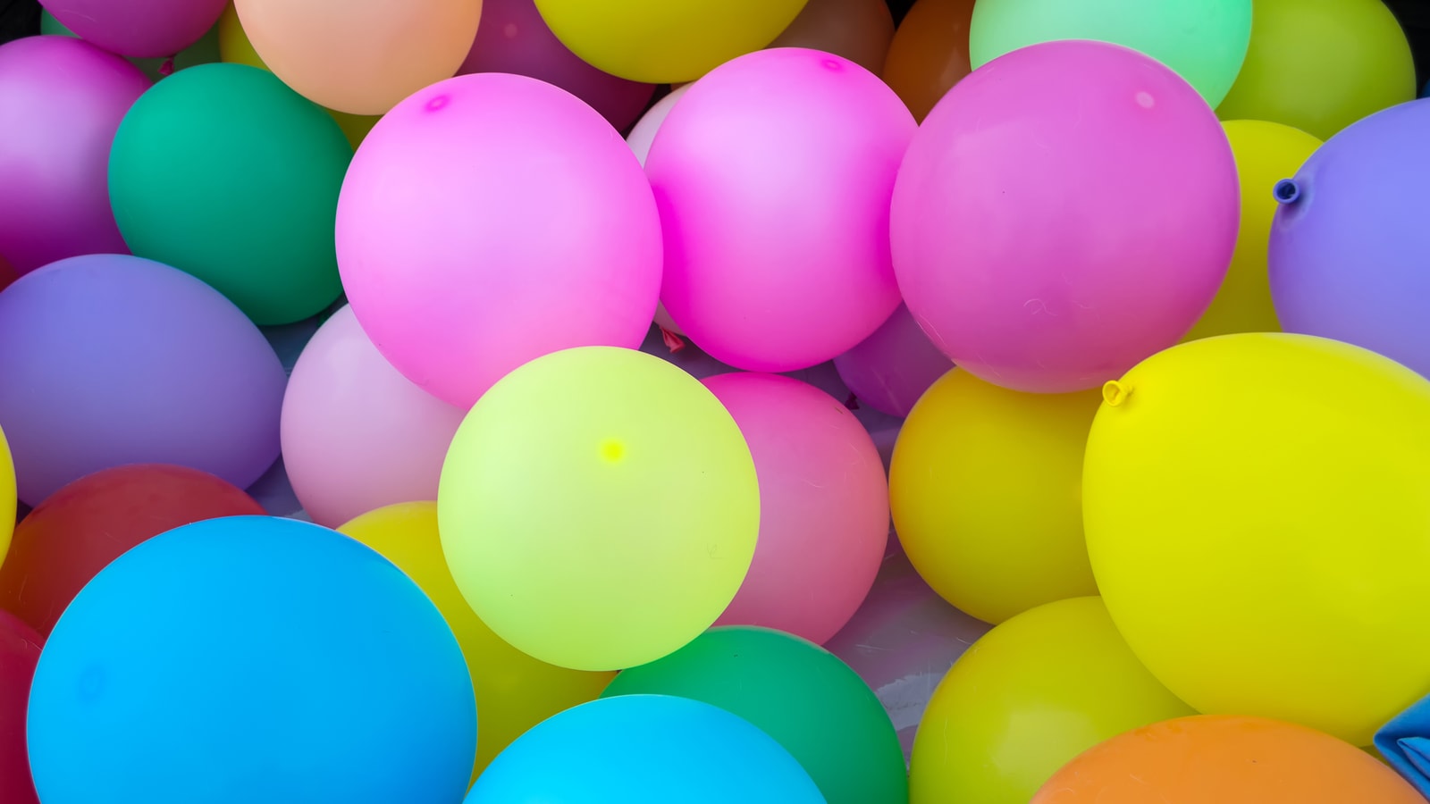 Birthday party backdrop with balloons and celebration decor