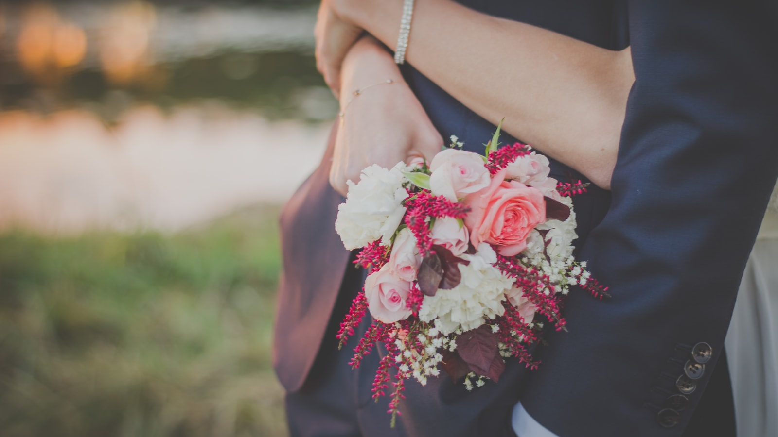 Wedding stage decor with flowers and warm event lighting