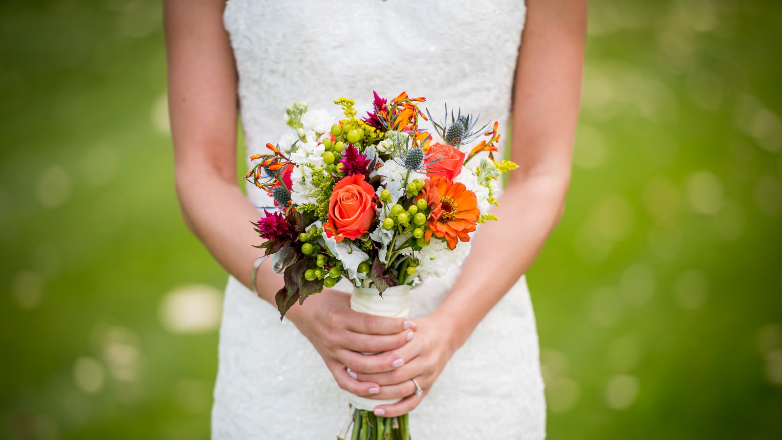Wedding stage decor with flowers and warm event lighting