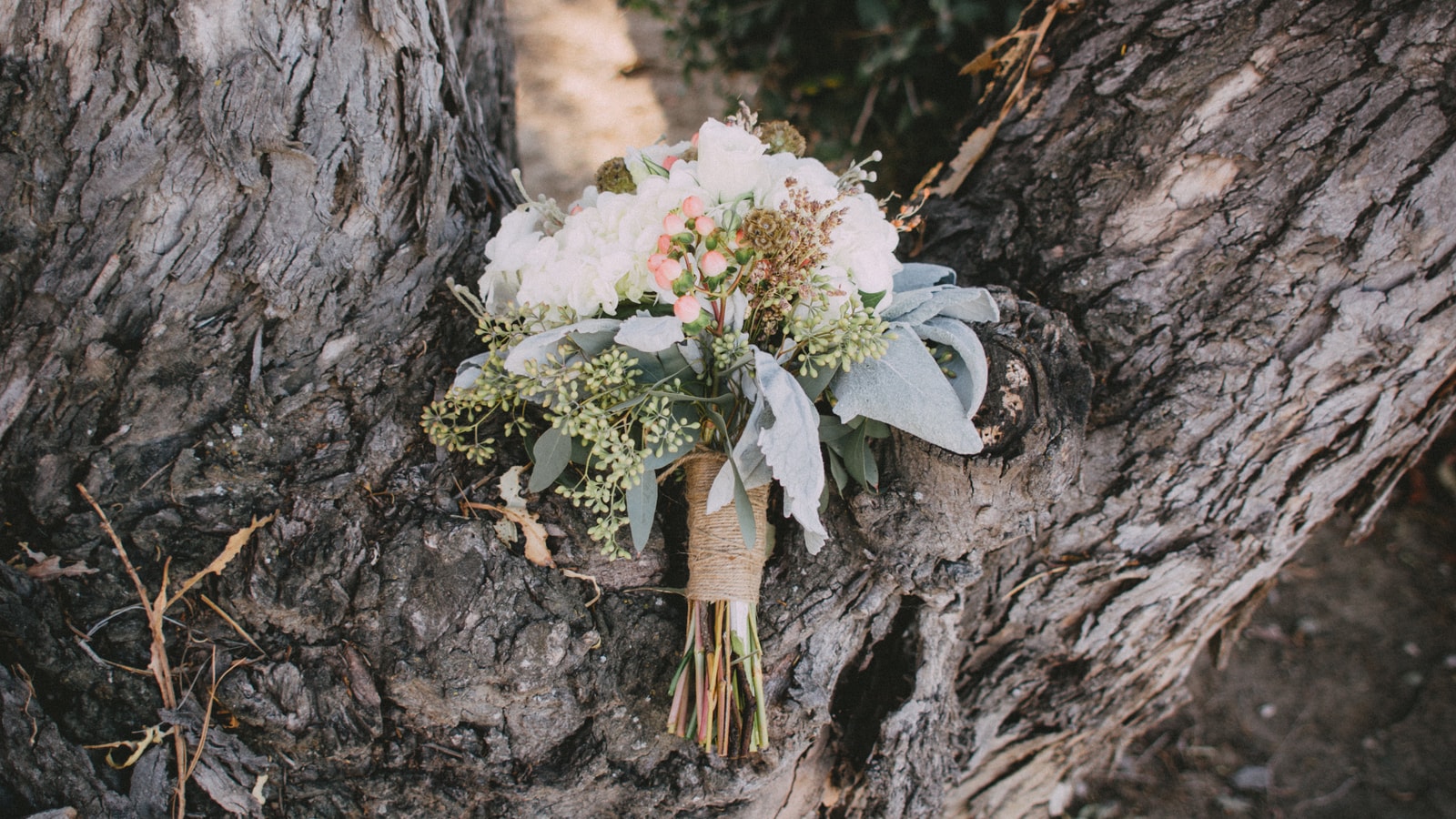 Wedding stage decor with flowers and warm event lighting