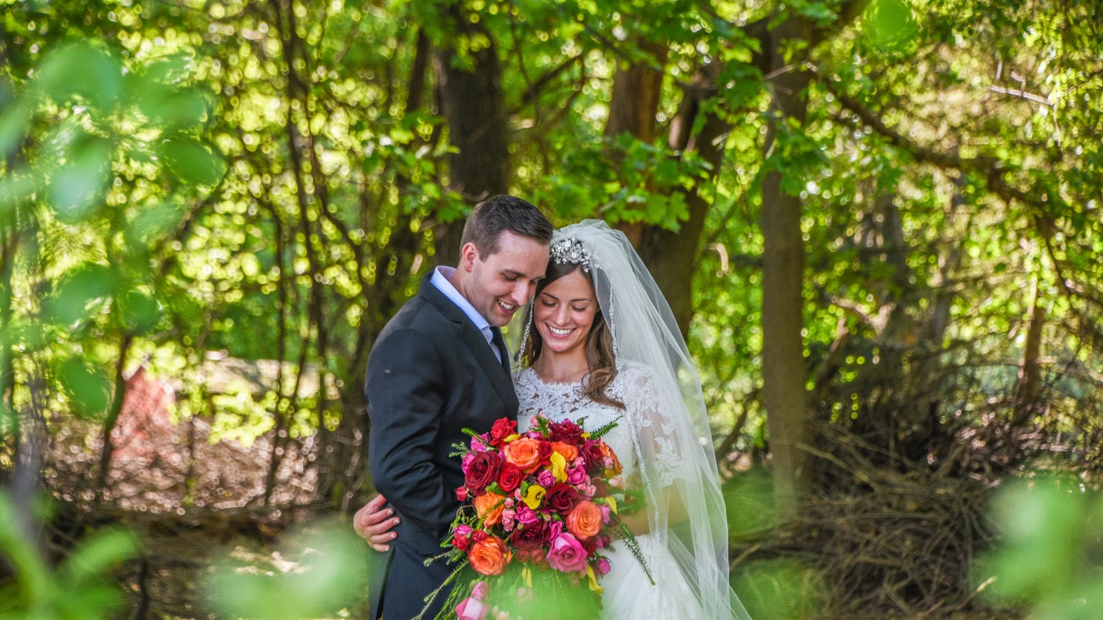 Wedding stage decor with flowers and warm event lighting