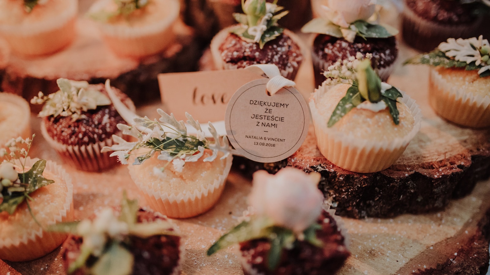 Decorated celebration venue with floral styling and event details
