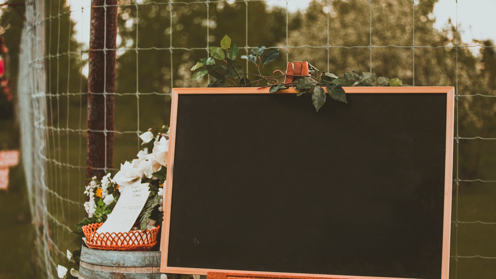 Wedding stage decor with flowers and warm event lighting