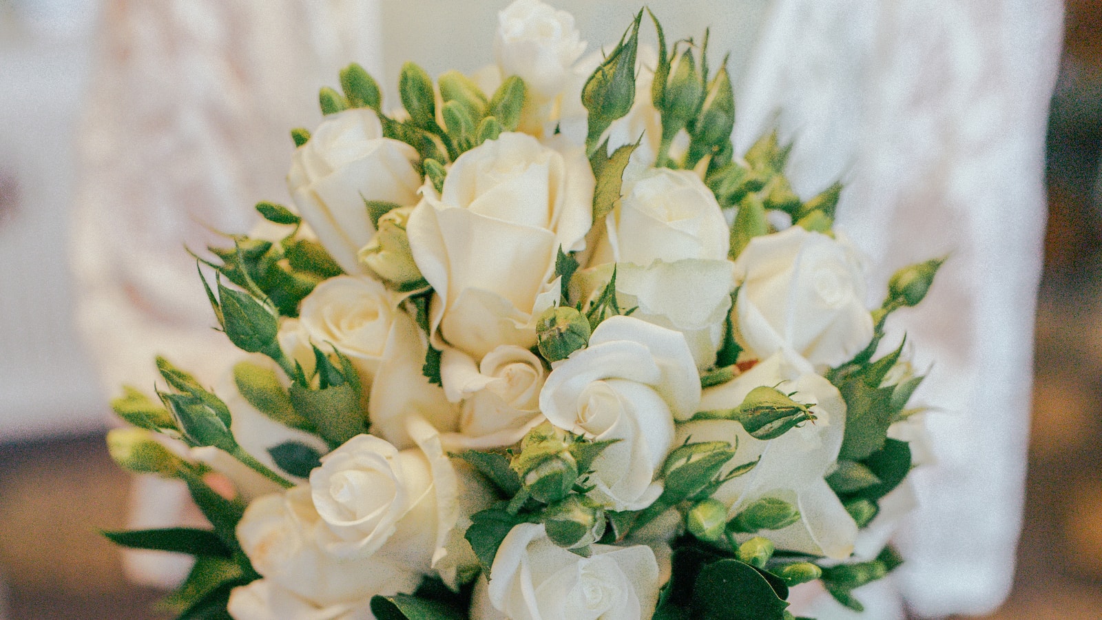 Wedding stage decor with flowers and warm event lighting